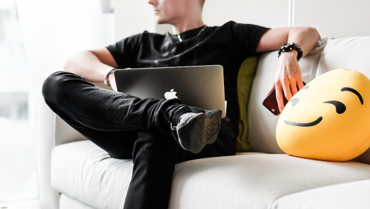 Man on lounge with laptop